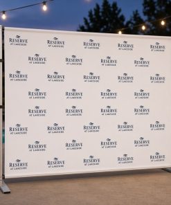 Step and repeat backdrop at an apartment community poolside leasing event