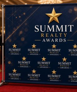 Step and repeat backdrop with textured navy background at an awards night