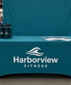 Teal stretch table cover with logo at a trade show booth