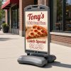 Wind Sign sidewalk sign with grey wheeled frame outside a pizzeria